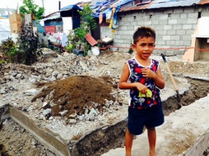 Philippines--Boy in trenches