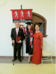 Chinh Doan at College graduation with parents