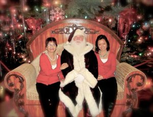 Chinh Doan and mom with Santa Claus in America