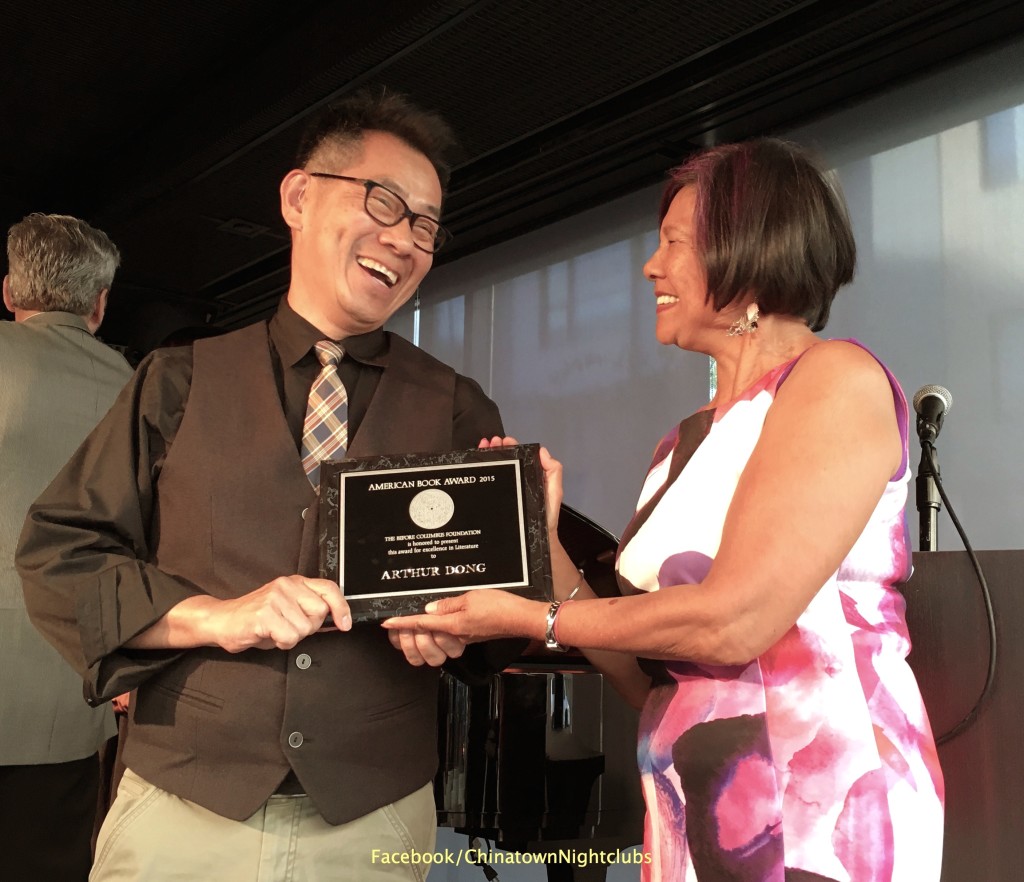 Arthur Dong receives the American Book Award from poet/playwright Genny Lim at the 36th Annual American Book Awards ceremony at the San Francisco Jazz Center on October 25, 2015. Photo by Lorraine Dong
