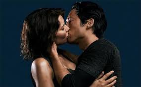 Steve Yeun as Glenn in a deep embrace with Maggie (Lauren Cohan) in The Walking Dead