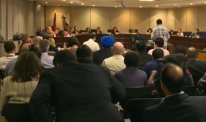 200 people pack a hearing to discuss changes in history books used in California