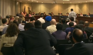 200 people pack a hearing to discuss changes in history books used in California 