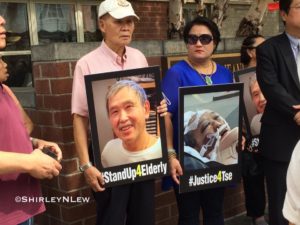 Marchers hold before and after images of Mr. Tse.